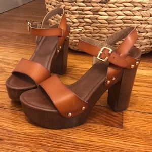 Tan faux leather platforms with gold stud detail